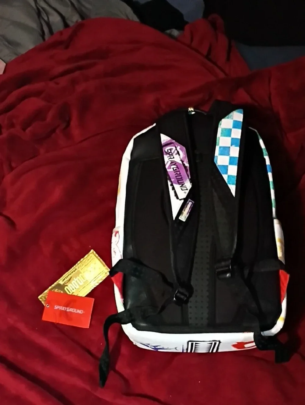 Sprayground White Backpack with Purple Shark Graphic and Green Money-Bag Accents